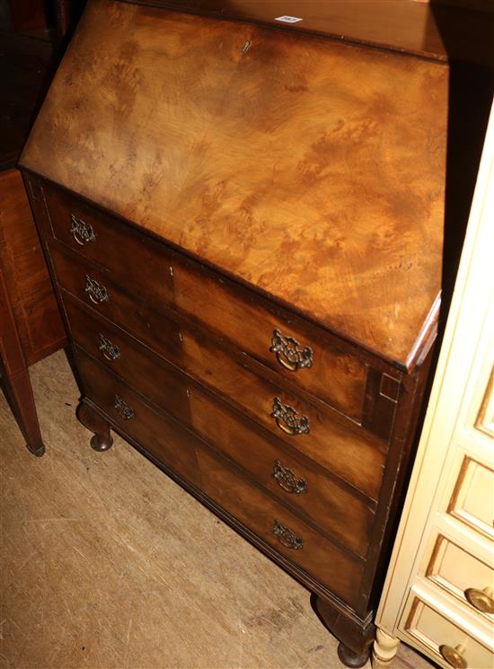 A 1930s banded walnut bureau, on short front cabriole legs